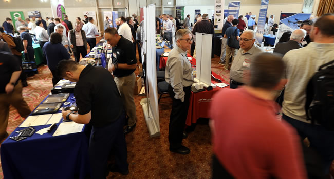 A packed exhibit floor at the 2024 IEEE LI Power Electronics Symposium